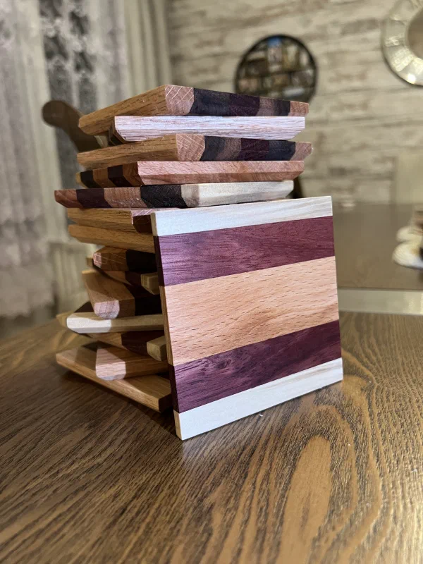Tower of several oiled and waxed wood drink coasters with natural soft light